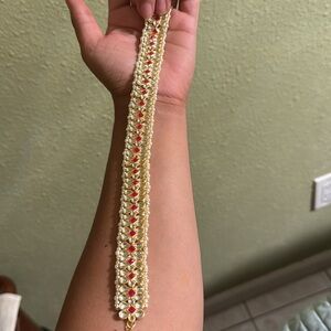 Indian braid or headband Jewelery in gold, red and white.